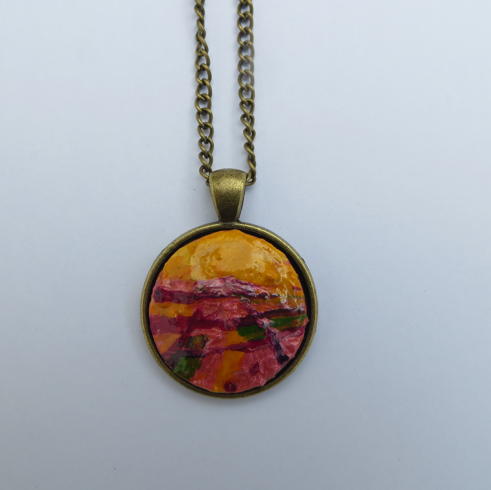 A bright and bold hand painted pendant