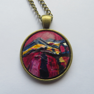 A vibrant handpainted pendant in magenta